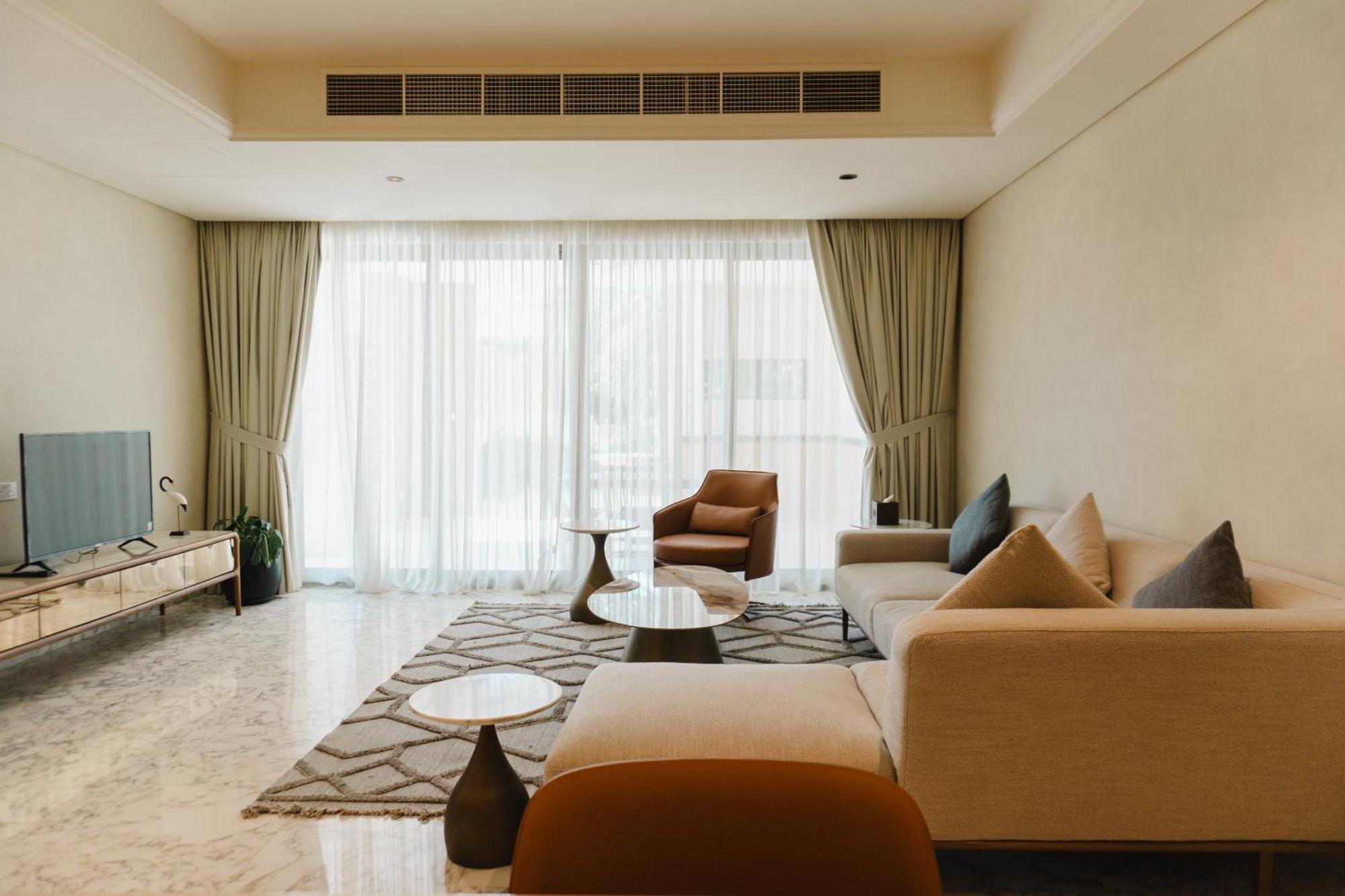 Palavra Resort Al-Manamah Bagian luar foto A living room in a condominium